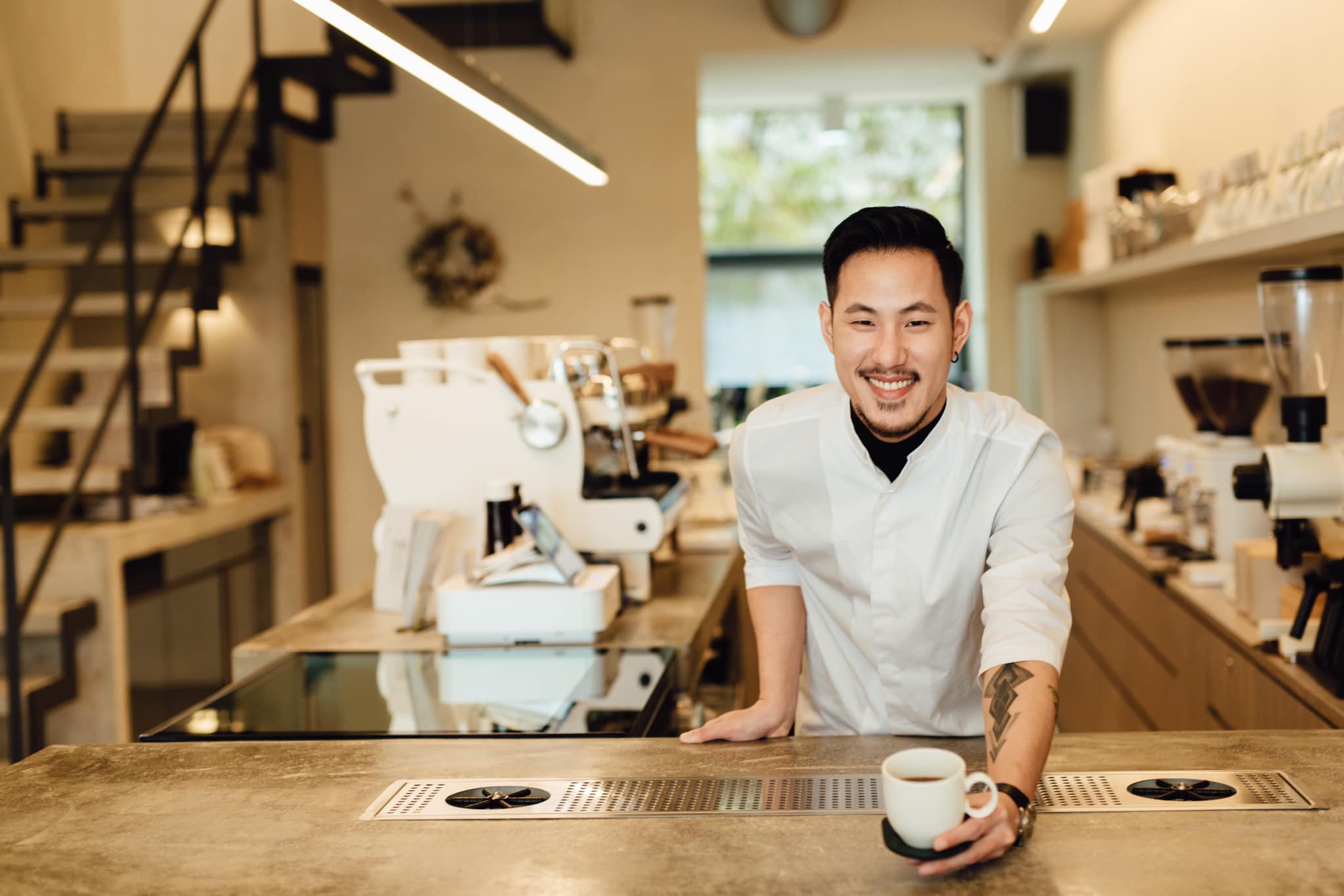 Chad Wang serving a brew coffee